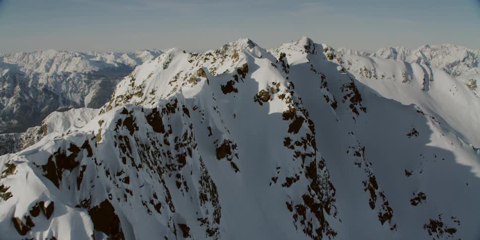 Snow covers the mountainous landscape