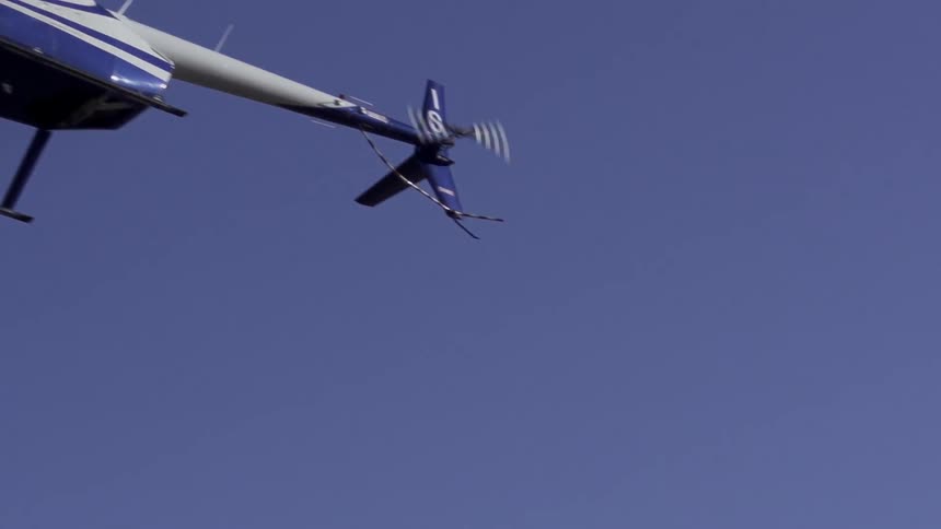 A helicopter flying on a bright sunny day