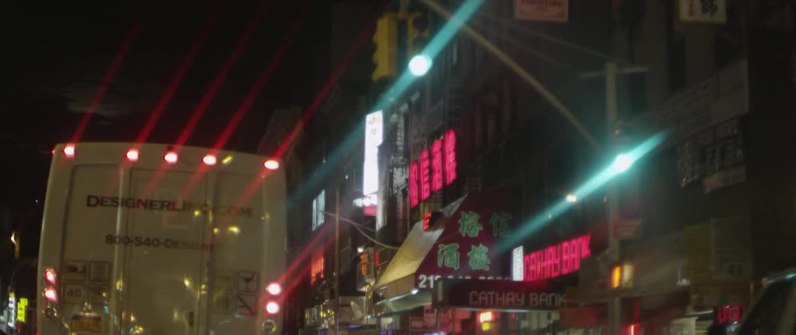 Following behind a truck in the city at night