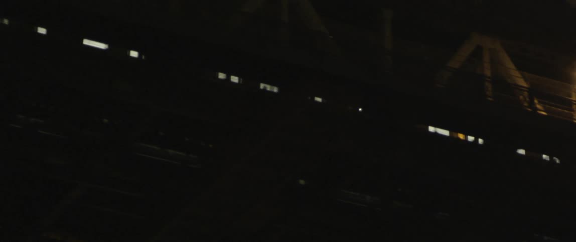 Train can be seen moving on a platform at night