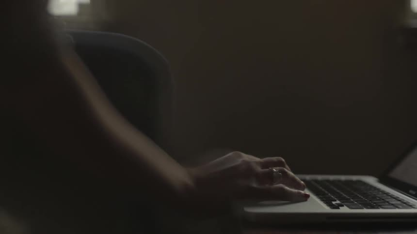 Person using a trackpad on a laptop