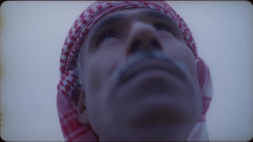 Man in turban looks towards the sky