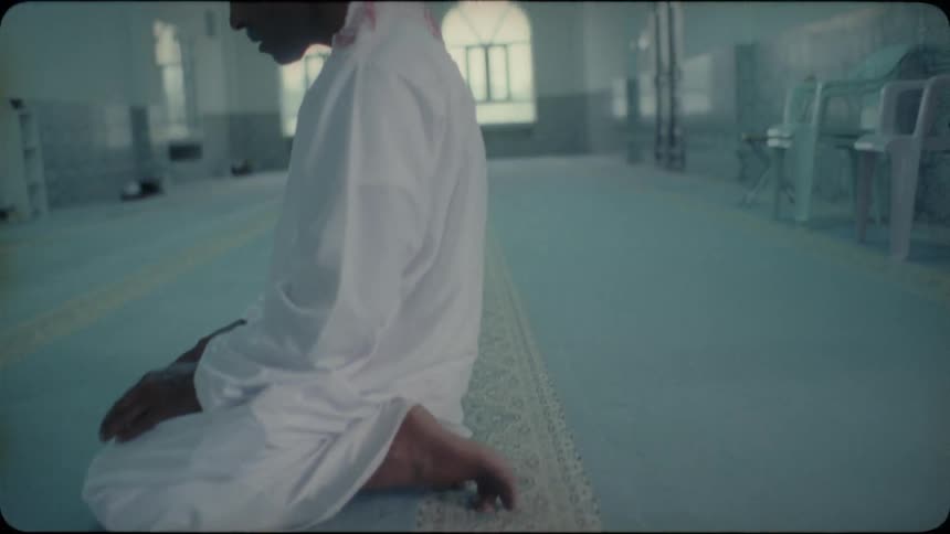 A man prays inside of a mosque
