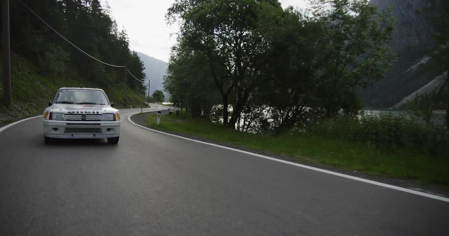 Car drives on a mountain road