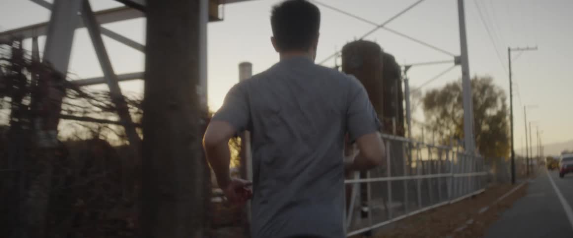 A man jogs down the street