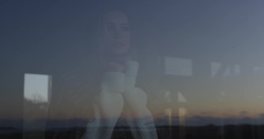 Woman looking out a window
