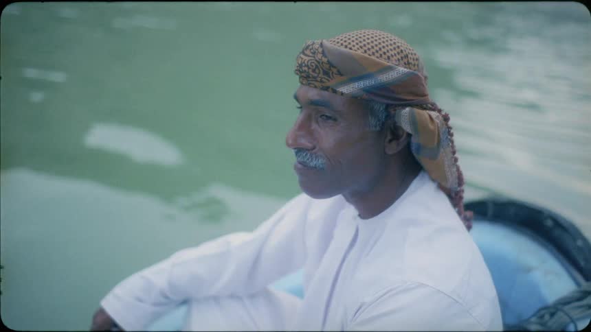 Man rides on a boat and nods