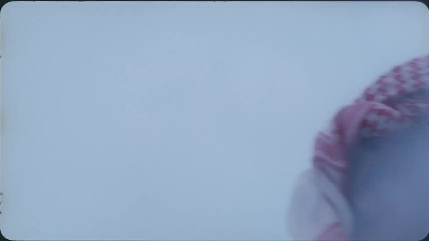 Man splashes water on his face on a foggy day