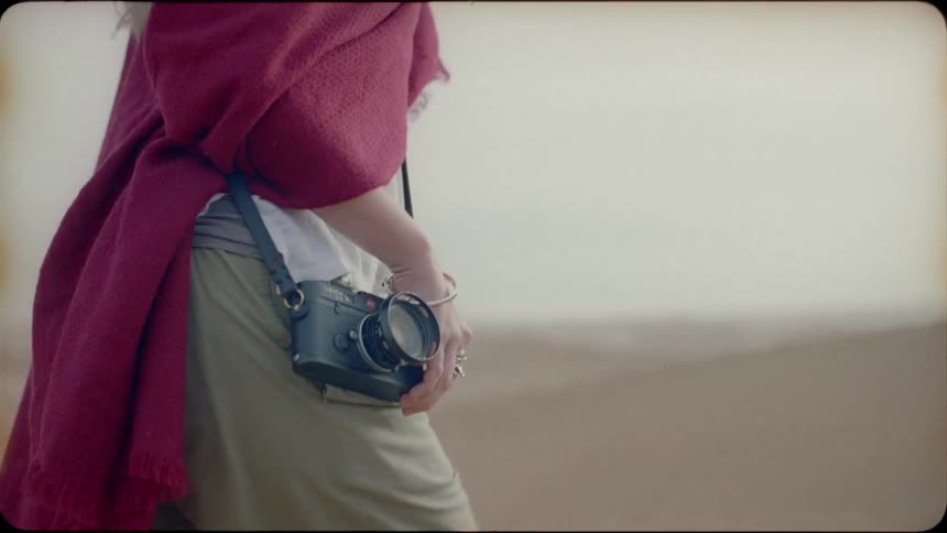 Photographer walks in a sandy desert