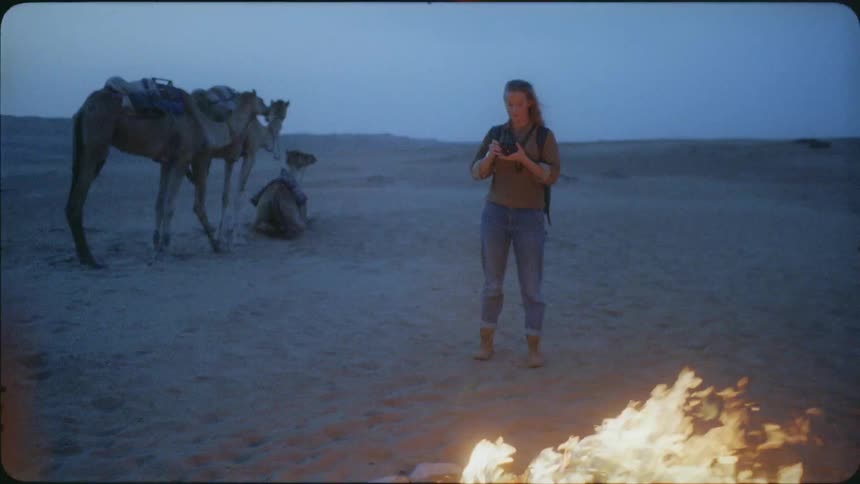 A female photographer prepares to take a photograph