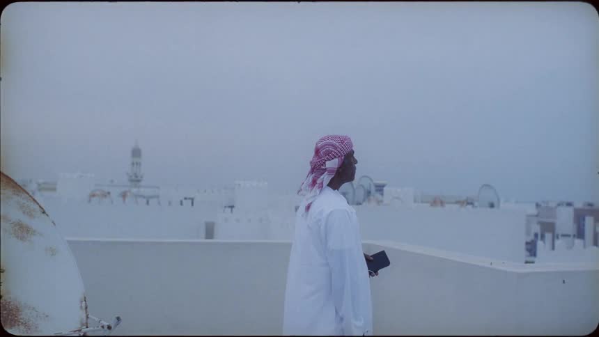 Man stands on a rooftop