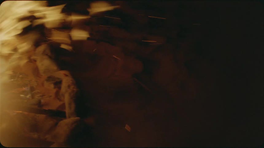 The campfire is raging at night