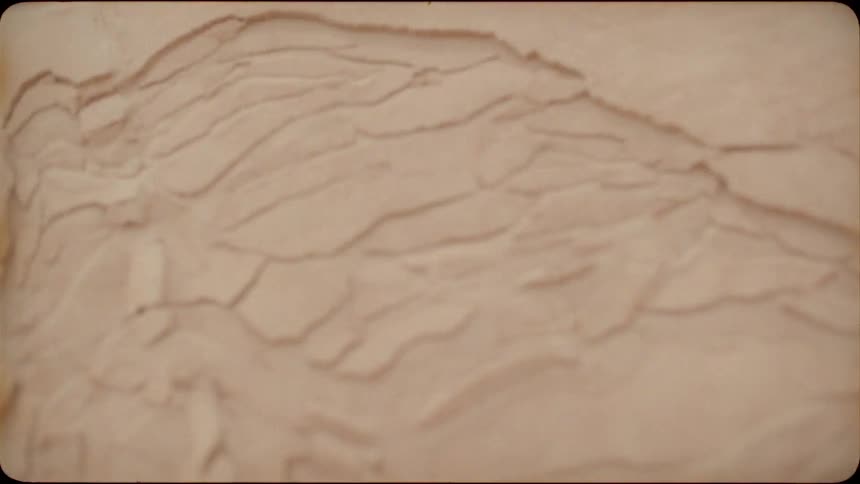 Sand on a slope cracks and slides down