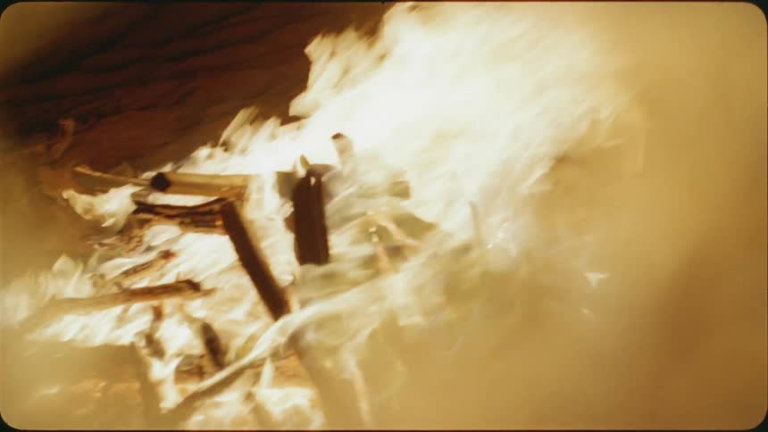 The fire is raging at the camp at night