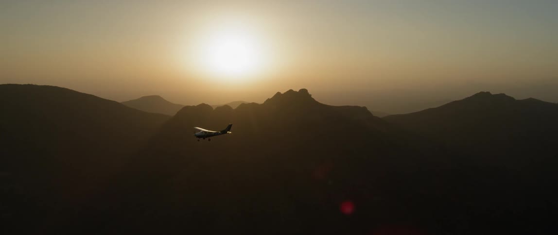 A small plane flies in the sky