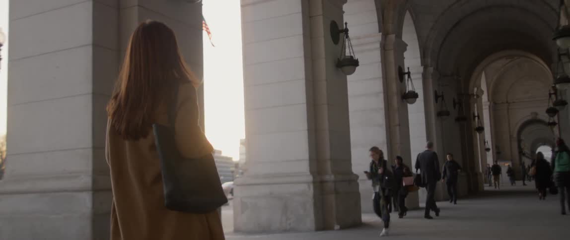 Pedestrians walk outside of a building