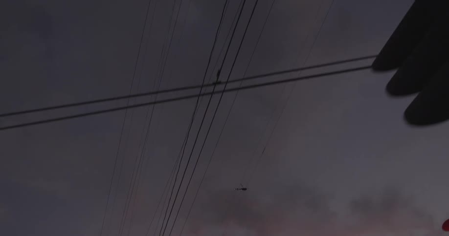 Helicopter in sky at dusk