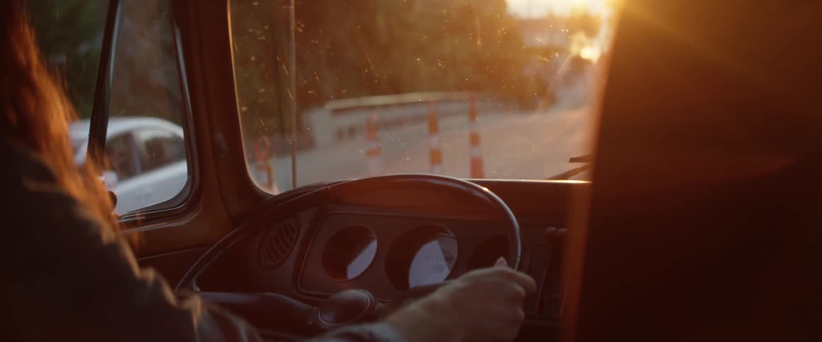 Man drives a vehicle down the road