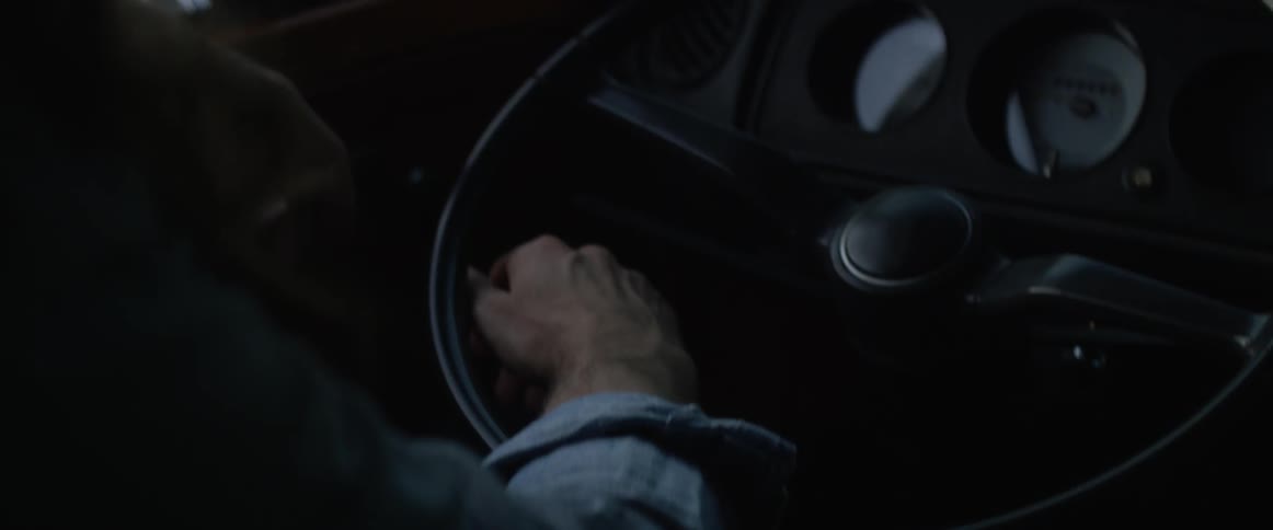 A man steers a vehicle