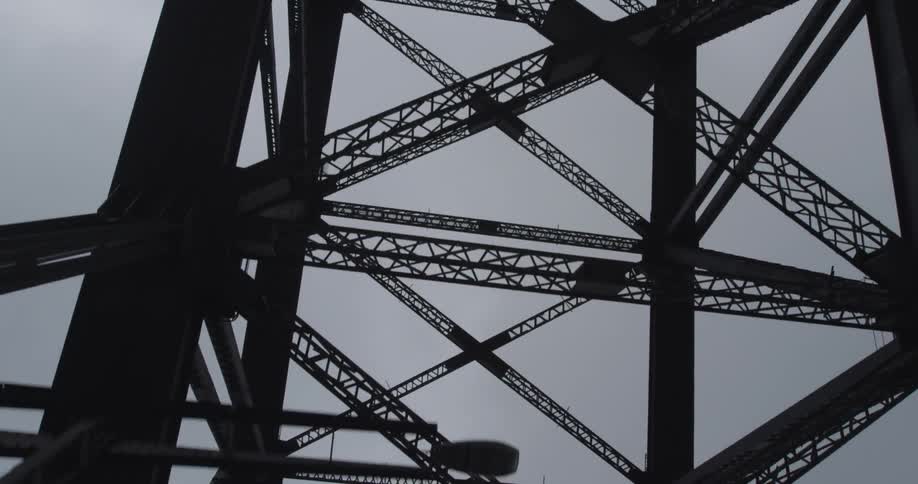 View of the top of a metal structure on a cloudy day