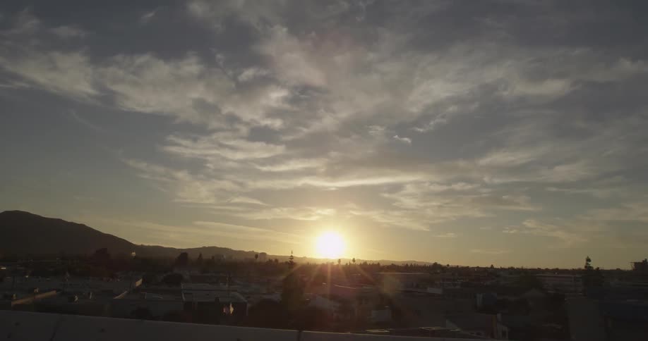 Sun setting in the distance on a cloudy day
