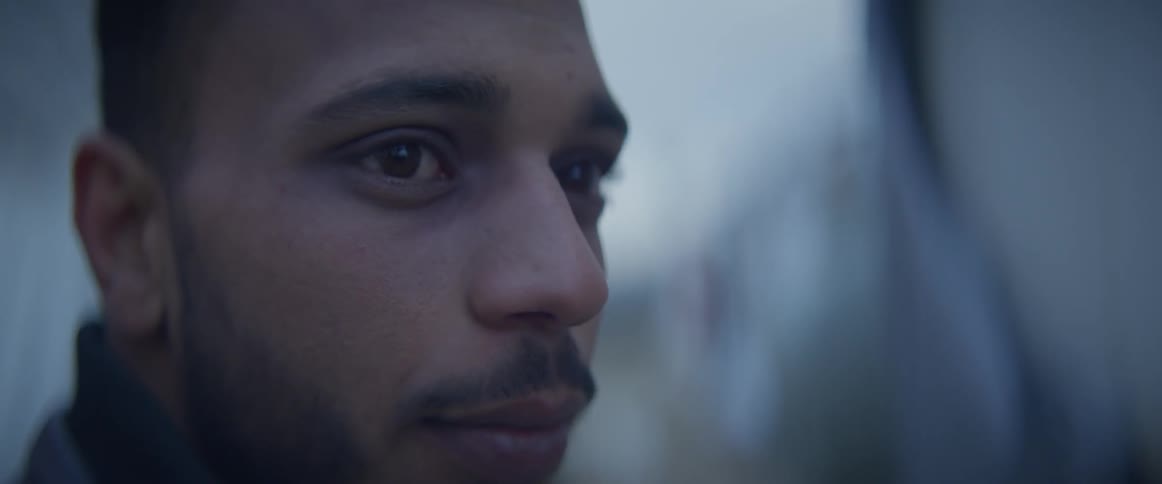 A man turns his head to the right