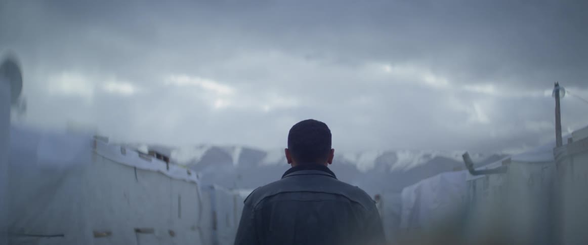 Man walks outside on a cloudy day
