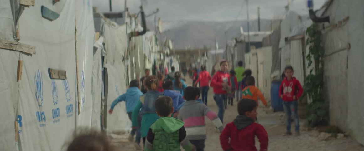 Young children run down the street