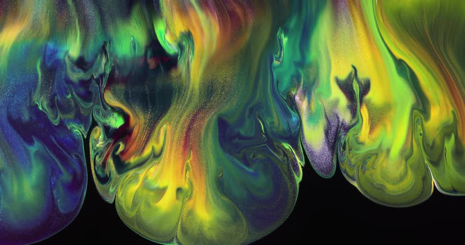 Multicolored liquid flows downwards to form abstract patterns