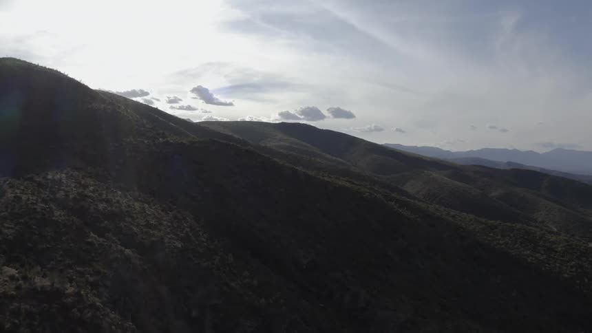 The heavy clouds cover the mountain range