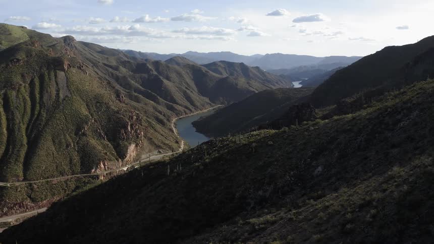A river runs between the hills