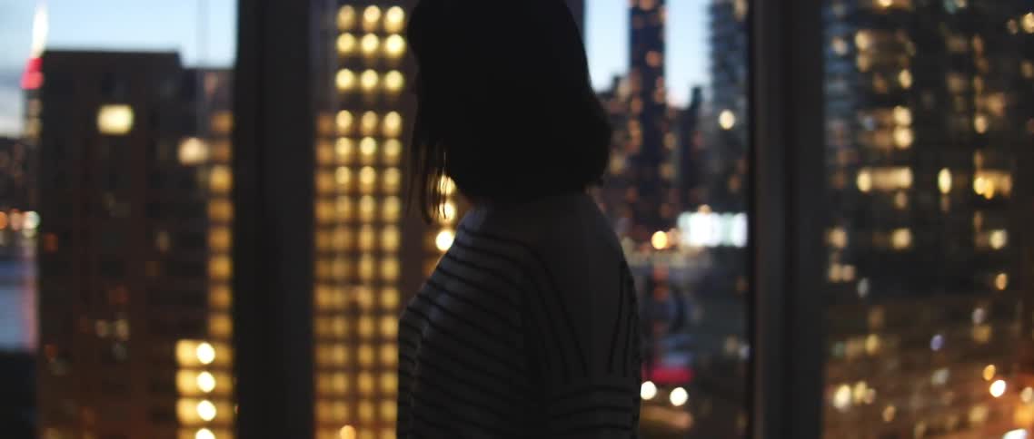 A person walking past windows