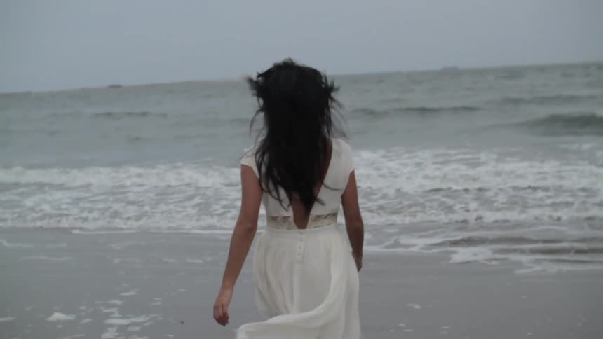 A person walking on the beach