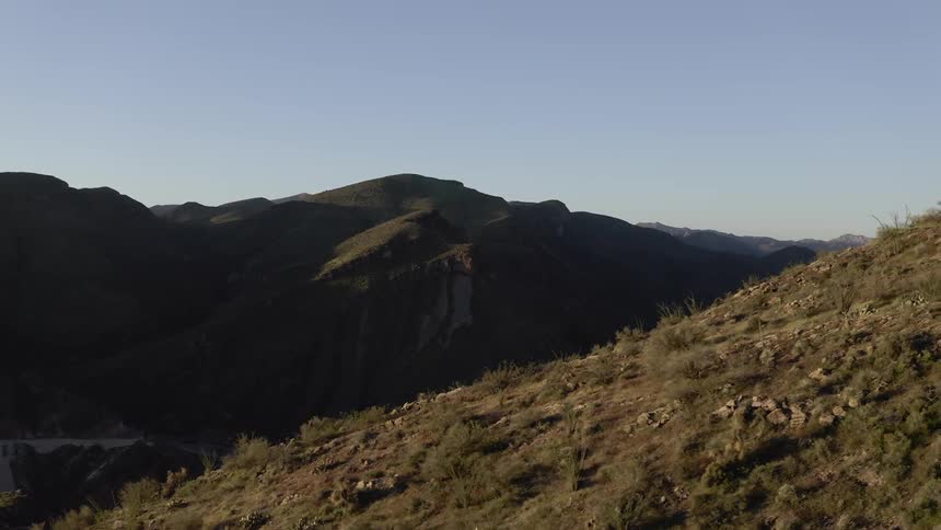 Grass and shrubs cover the mountain landscape