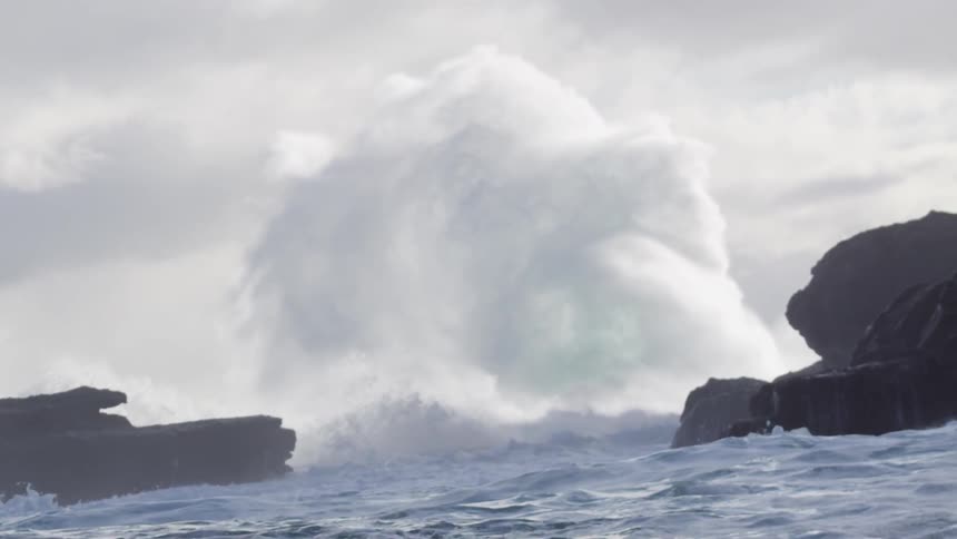 Waves crashing against rocks