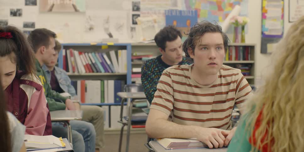 Student looks up from textbook