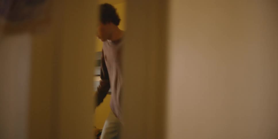 A man is jumping around in the room ahead
