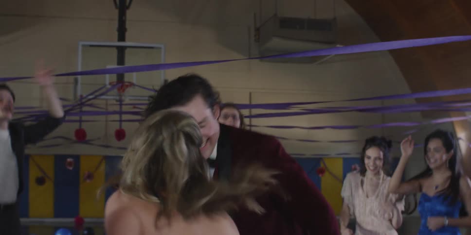 Teenagers dance in the gym together
