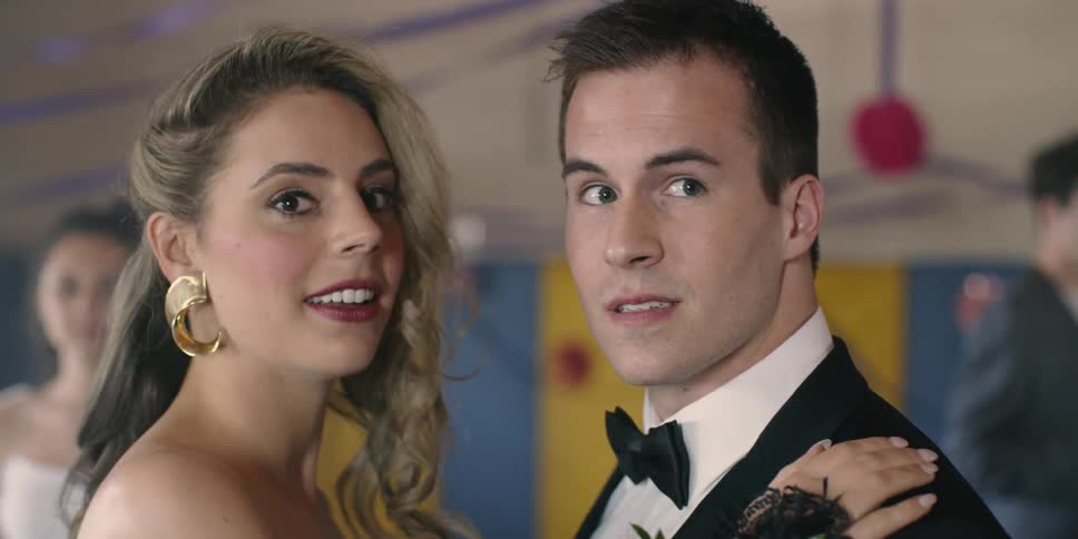 Man and woman dance and look over looking surprised