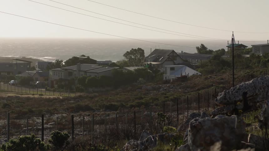 The hills lead to homes near the water
