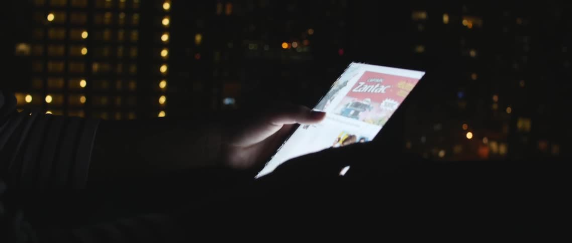 A person scrolling on a tablet