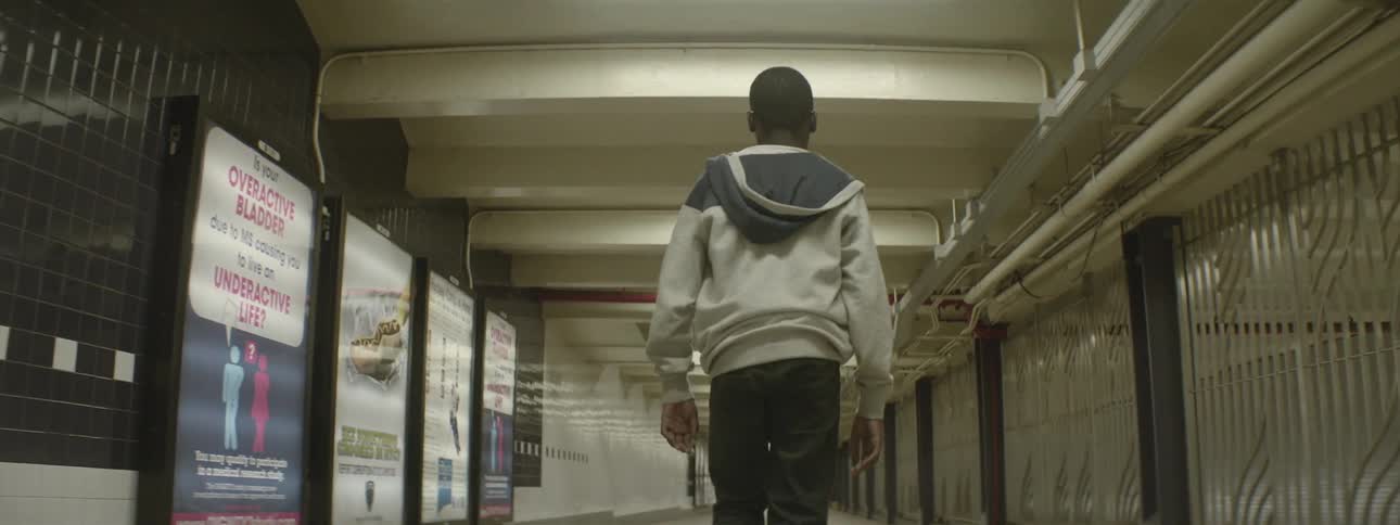 Boy walking in the subway