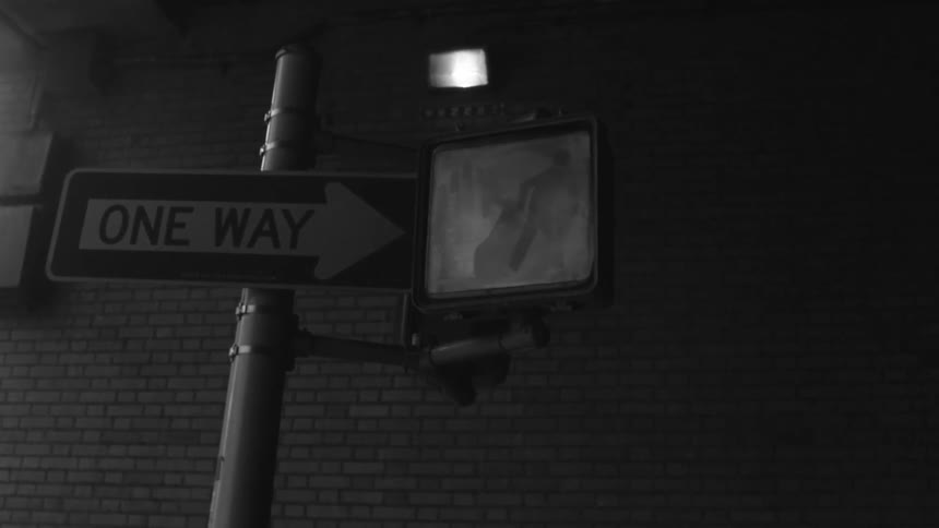 Close up of a street sign and crosswalk