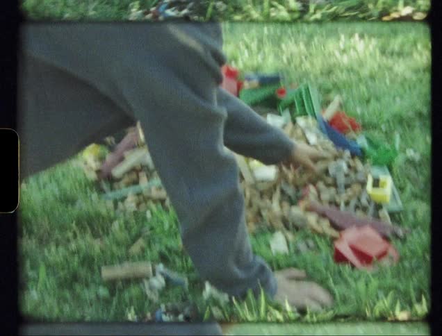 A child plays in the grass