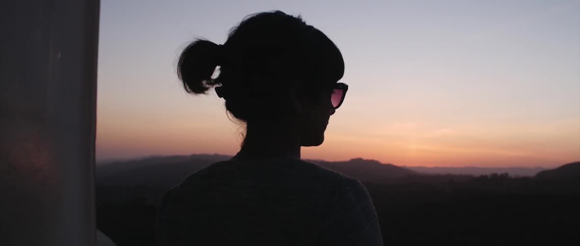 A person watching the sunset