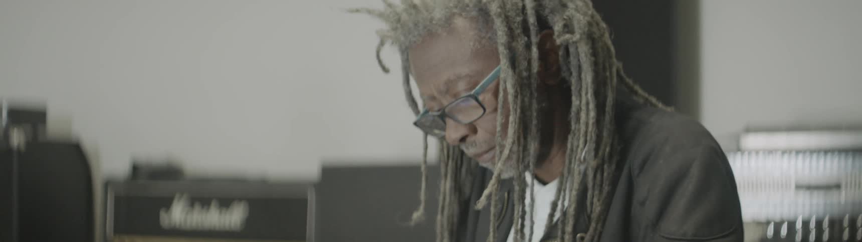 Man plays a keyboard in a studio