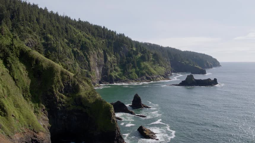 Ocean waves crash into the shoreline