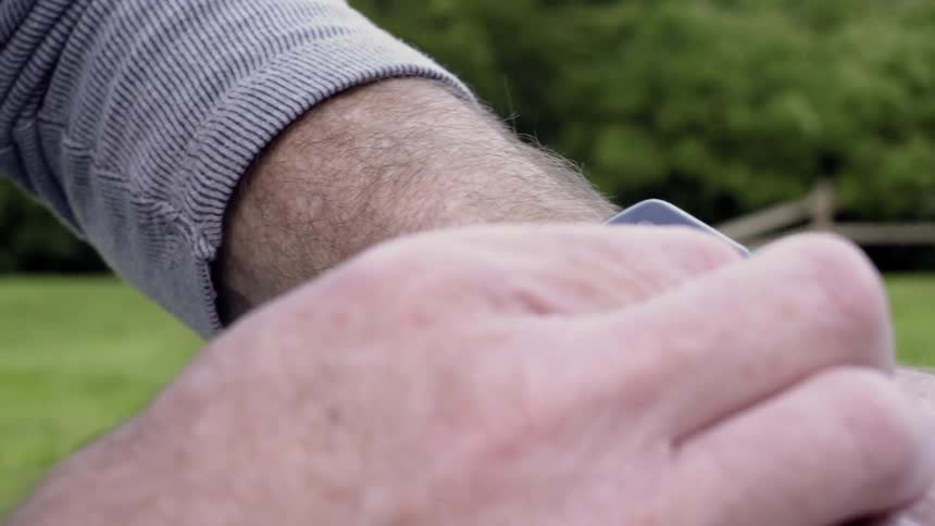 A man uses his smart watch