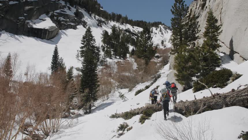A group hike up a snowy mountain