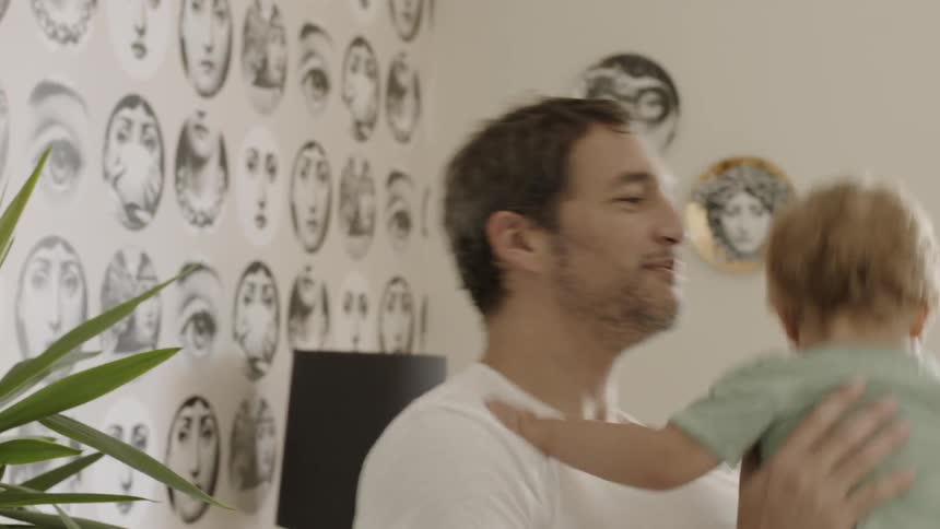 A man plays with a young child